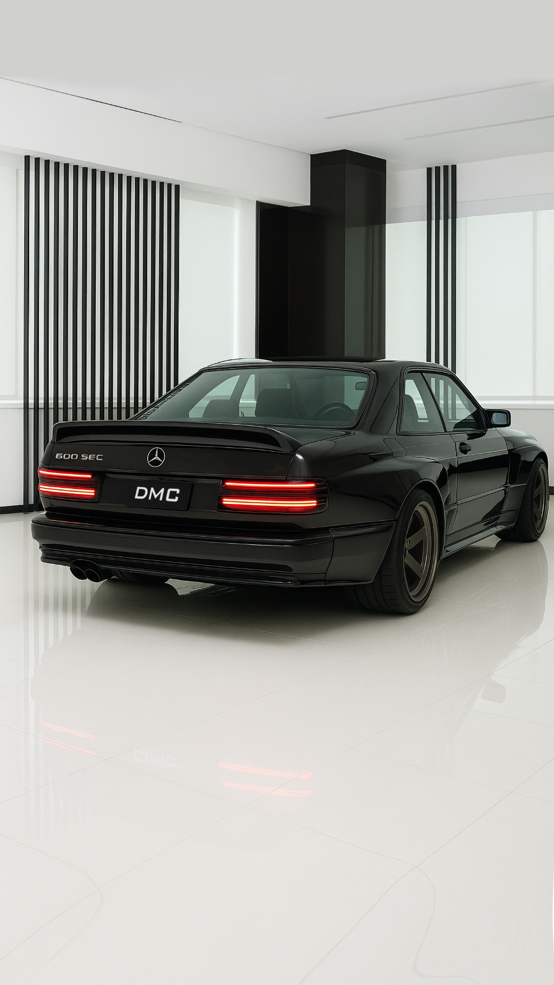 DMC Mercedes-Benz 560 SEC Widebody with modern LED lighting in a minimalist showroom