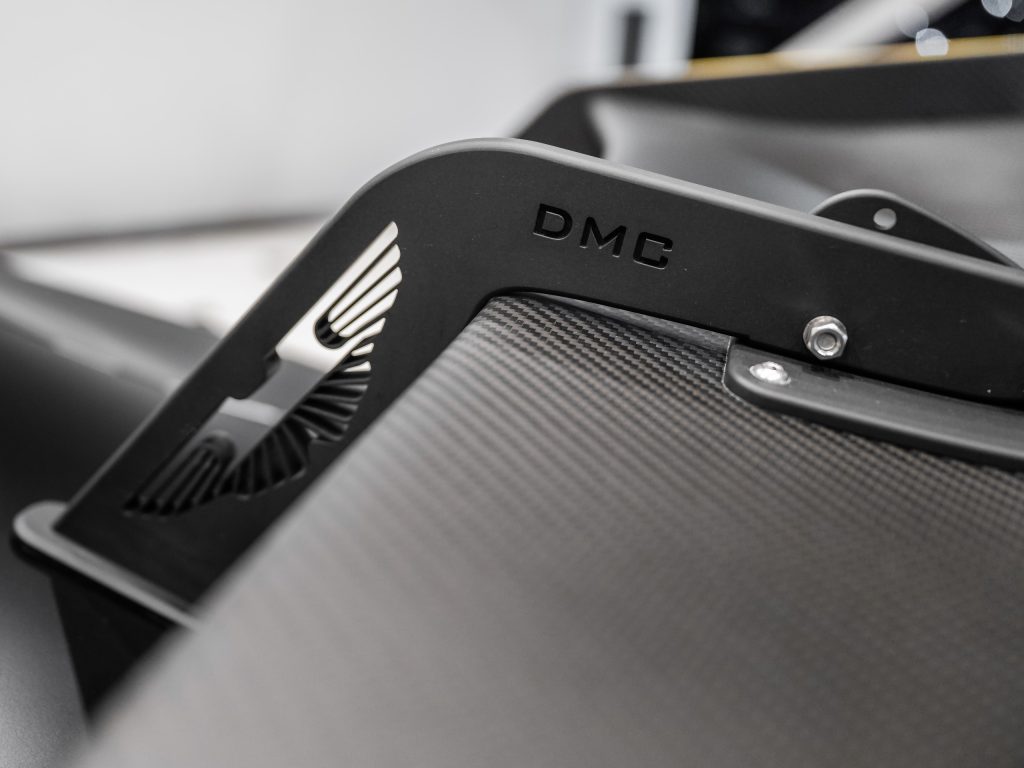 Custom CNC Wing Spoiler Brackets for the Aston Martin with its iconic OEM logo